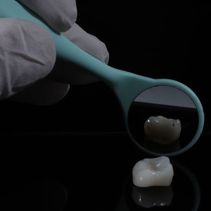 a dental crown being shown in a mirror